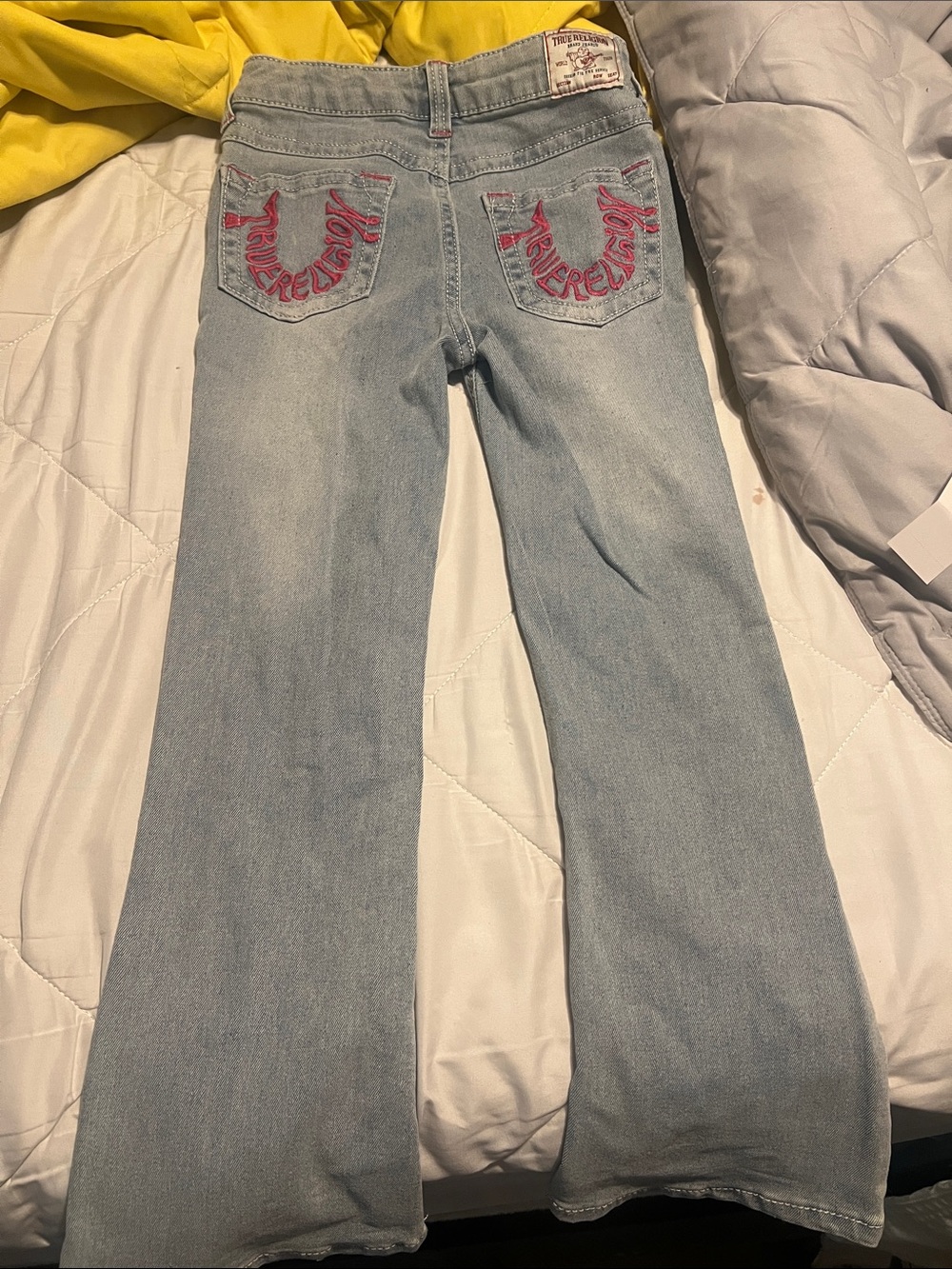 True Religion Light Wash Flare Jeans with Pink Pocket Stitching